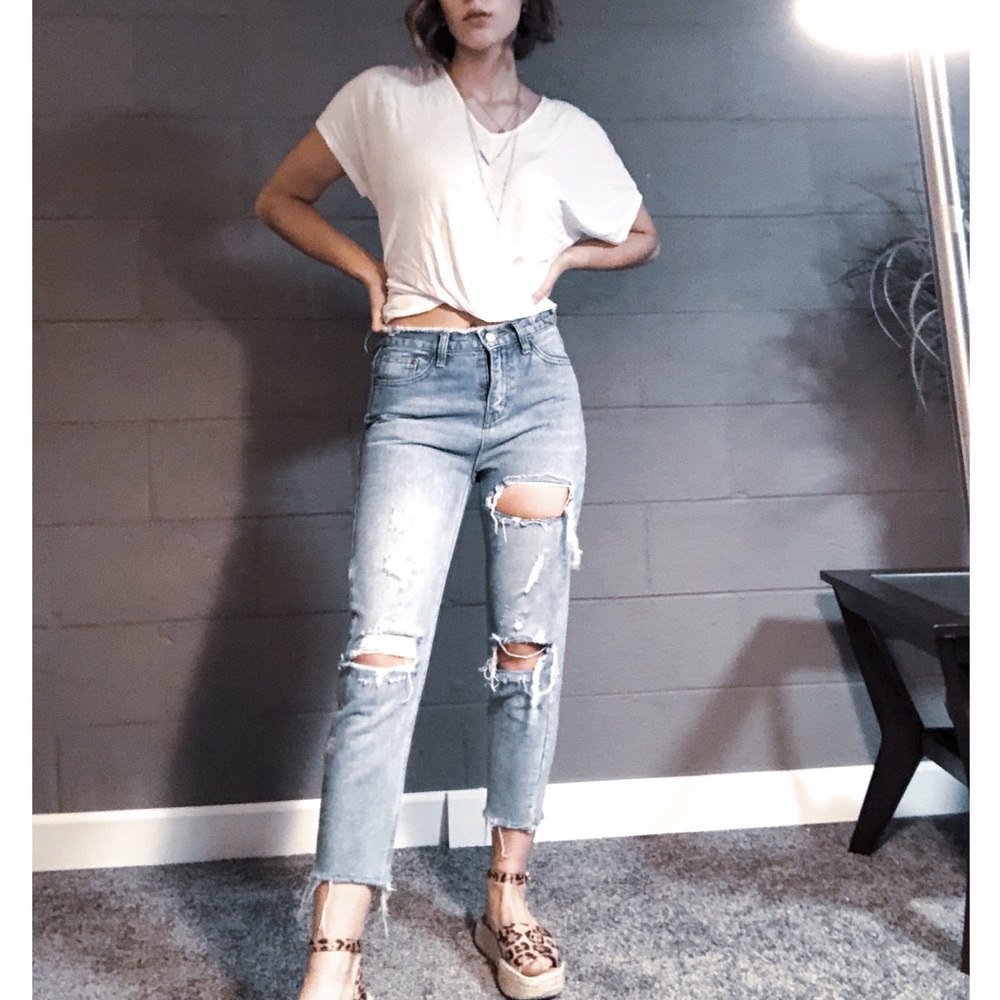 Distressed high-waisted denim jeans